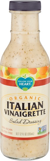photo of organic vegan italian dressing by follow your heart brand packaged in glass bottle with black screw on plastic cap and cream paper label