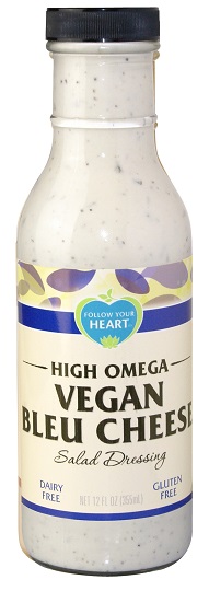 photo of vegan blue cheese salad dressing by follow your heart brand in glass bottle with black screw on plastic cap packaging and a blue and cream paper label
