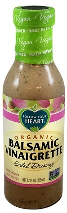 photo of organic vegan balsamic vinaigrette by follow your heart in glass container with screw on plastic cap packaging and cream, purple and blue paper label