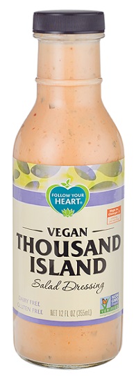 photo of vegan thousand island dressing by follow your heart brand packaged in glass bottle with black screw on plastic cap and paper label