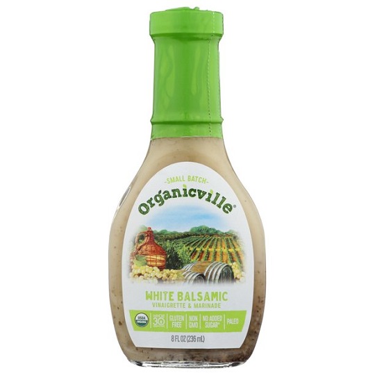 photo of organic vegan white balsamic dressing in glass jar and screw on cap packaging with white and green paper label
